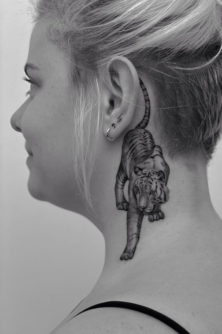 Tiger tattoo behind the ear