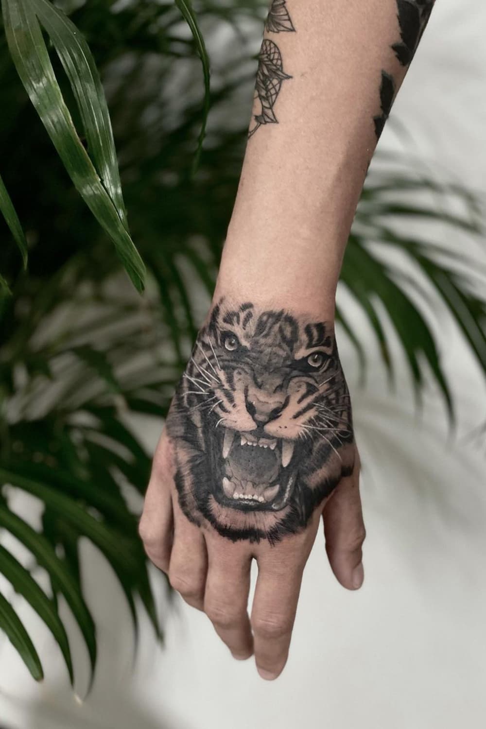 Tiger tattoo on hand