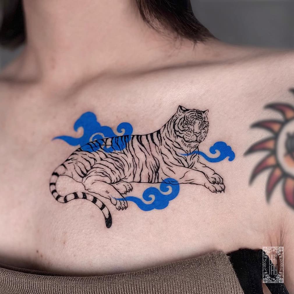 Tiger tattoo with blue cloud