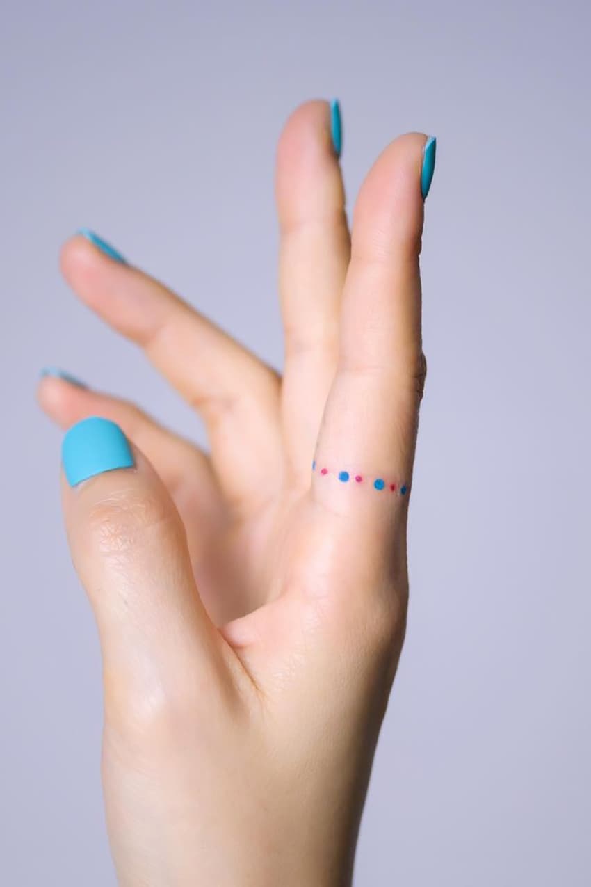 Colorful dot ring tattoo