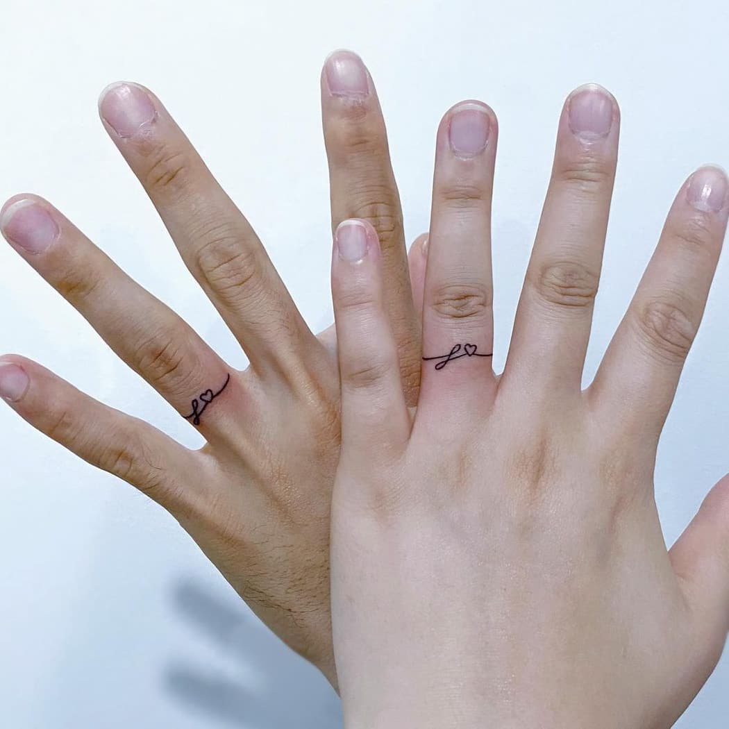 Cute heart couple ring tattoo