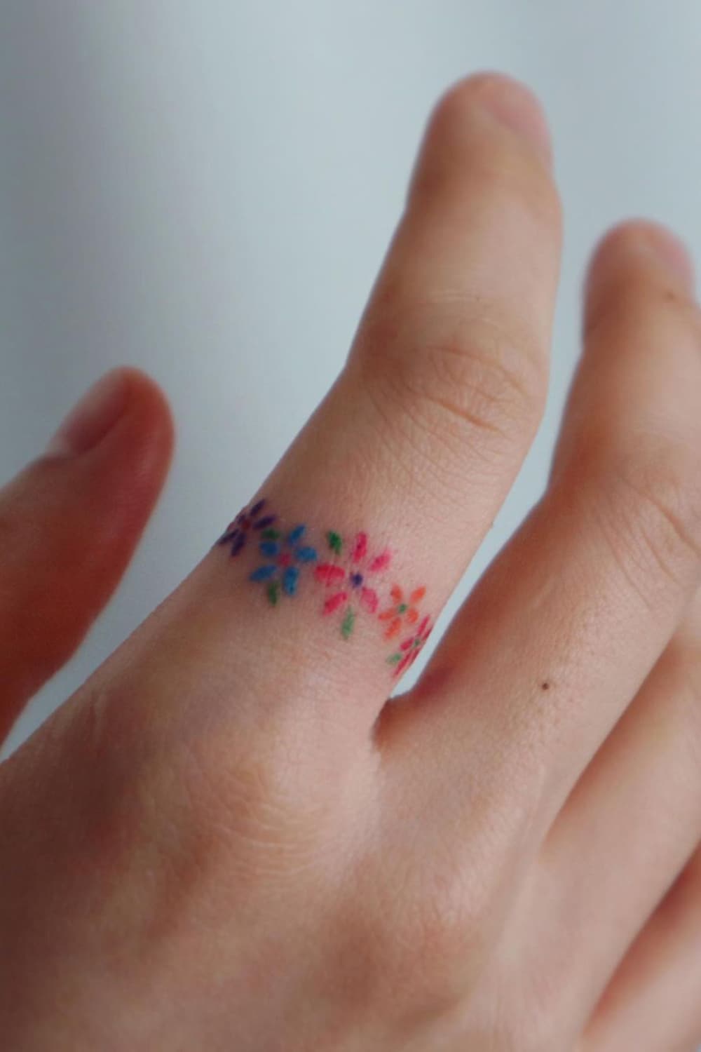 Flower ring tattoo