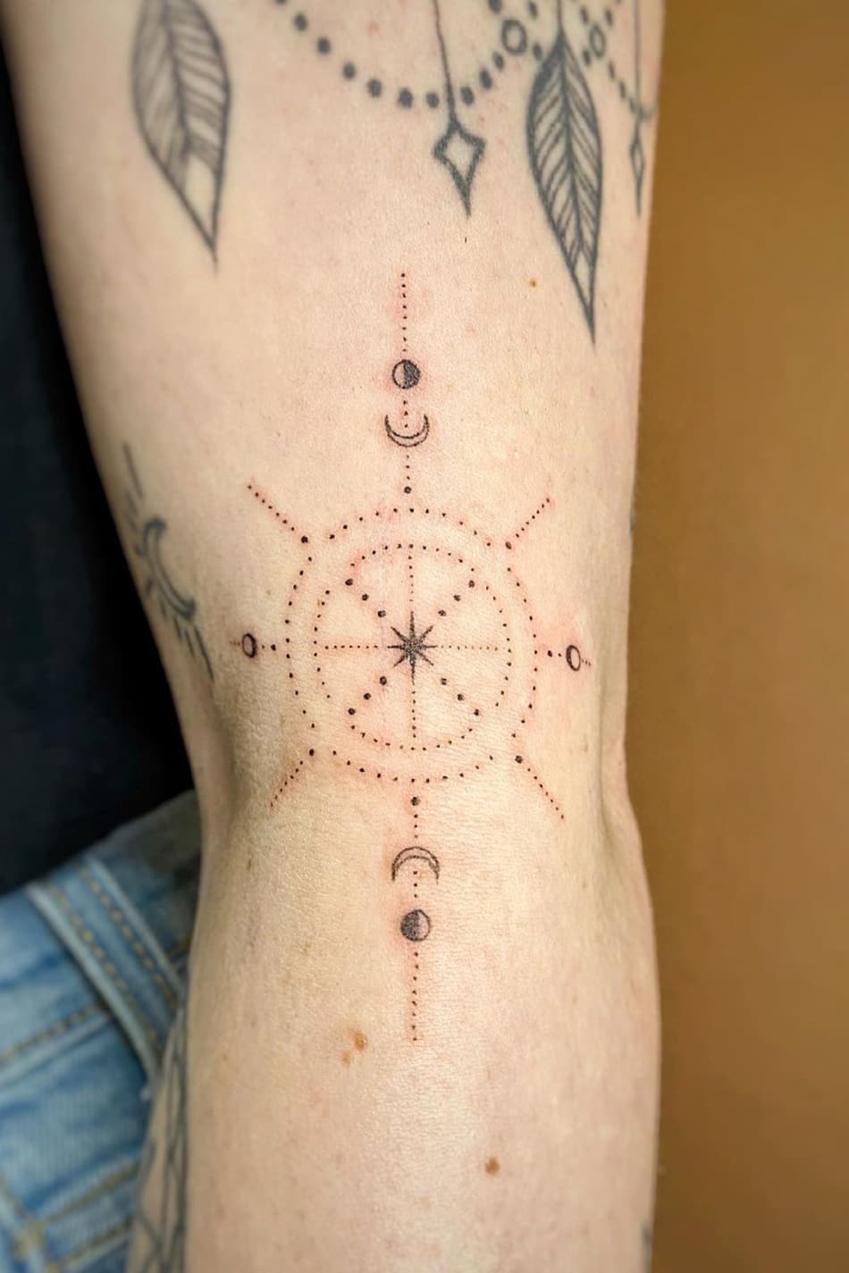 Minimalist compass tattoo