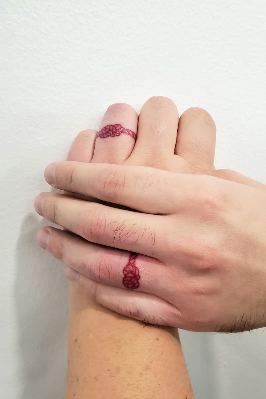 Rope ring couple tattoo