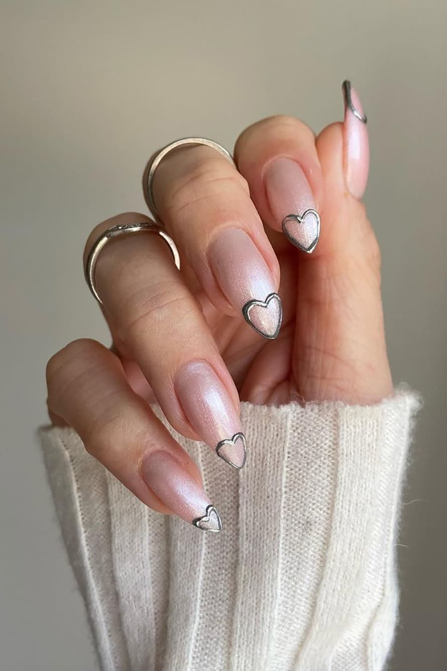 Shiny silver heart stiletto nails