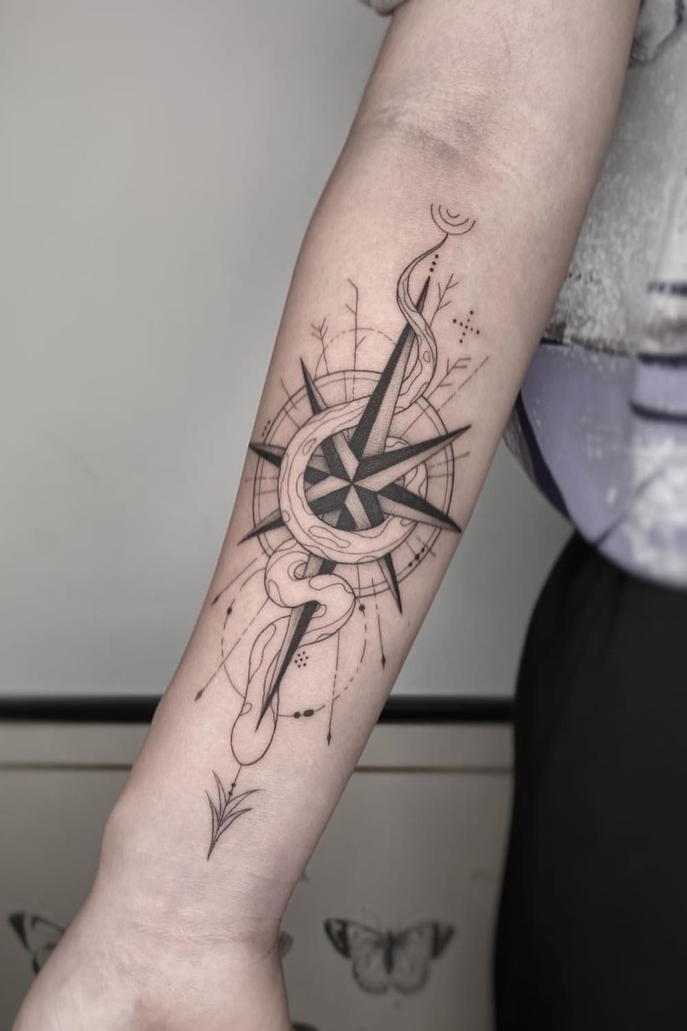 Snake compass tattoo