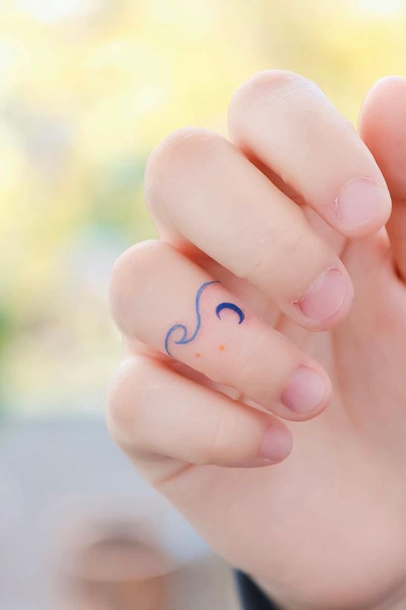 Wave and moon ring tattoo