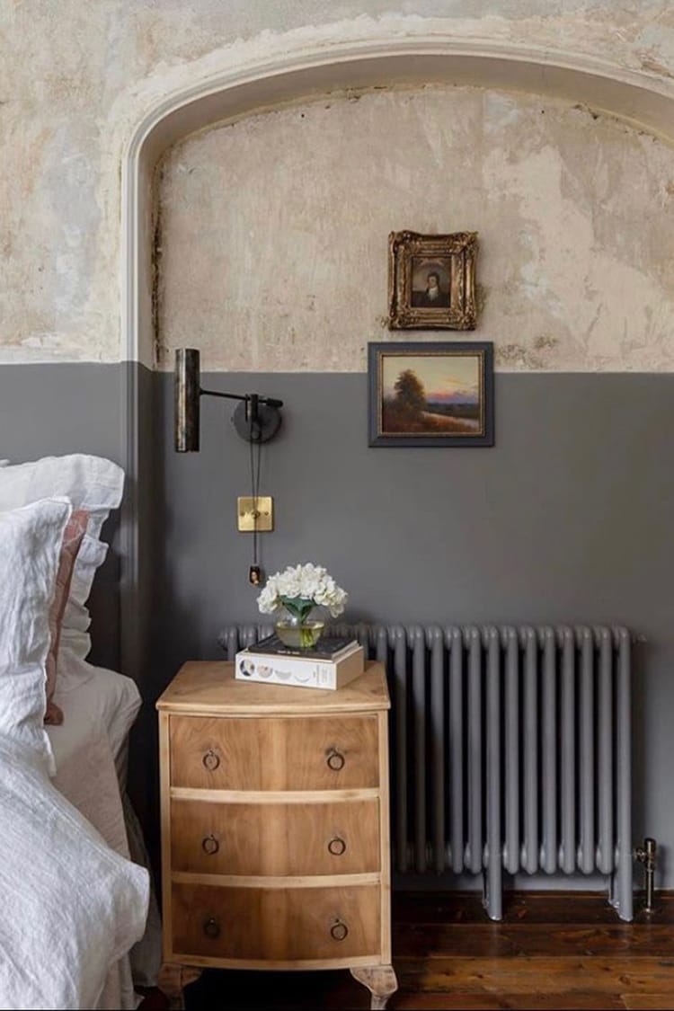 A rustic bedroom with two-tone feature walls