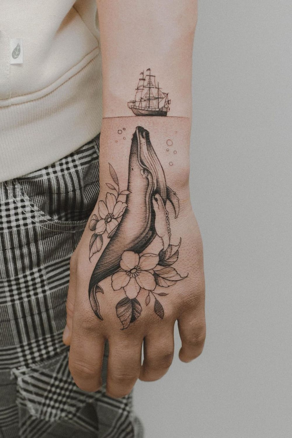 Creative whale tattoo on the hand