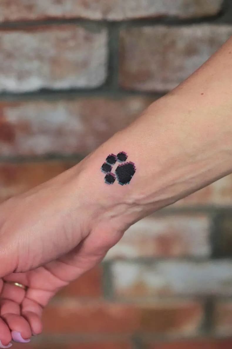 Pixel paw print tattoo