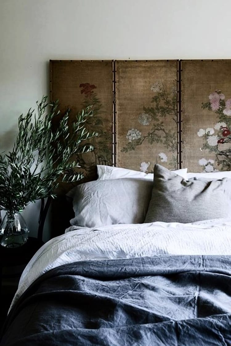 Rustic bedroom with antique headboard