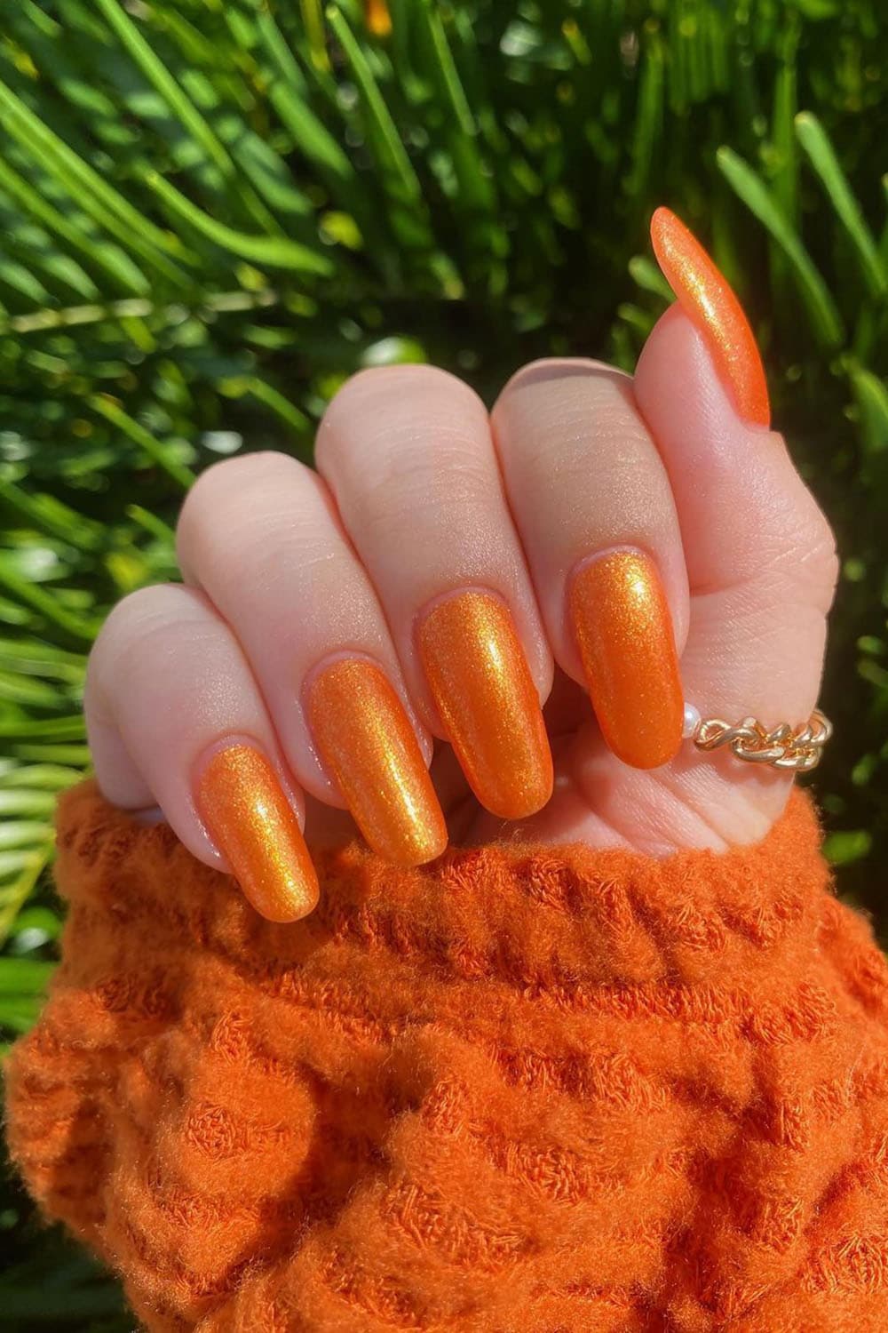 Shining golden orange nails
