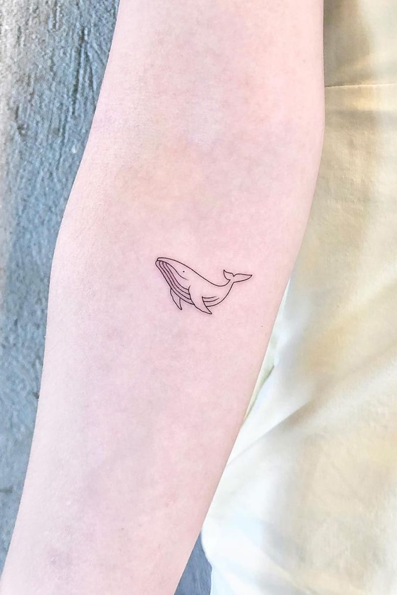 Tiny whale tattoo