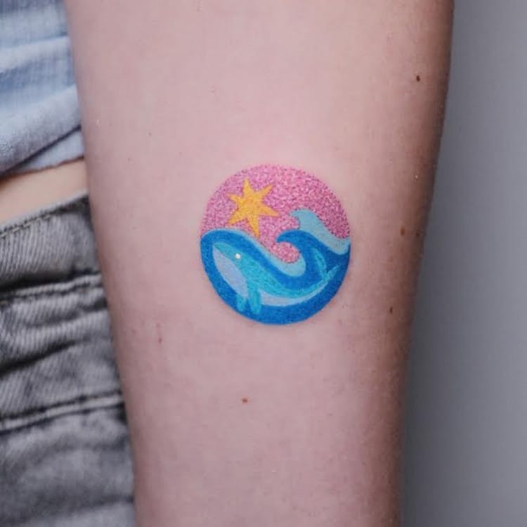 Whale symbol tattoo