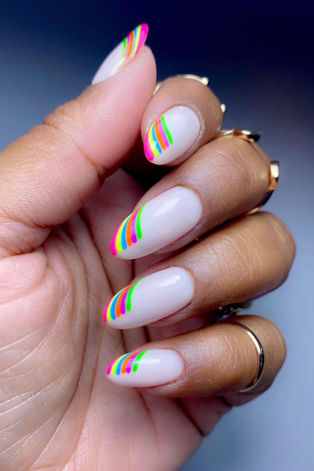 White nails with creative rainbow tips