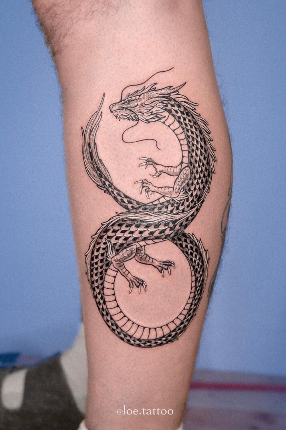 Dragon tattoo on lower leg
