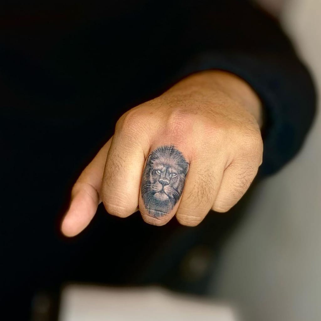 Lion Ring Tattoo