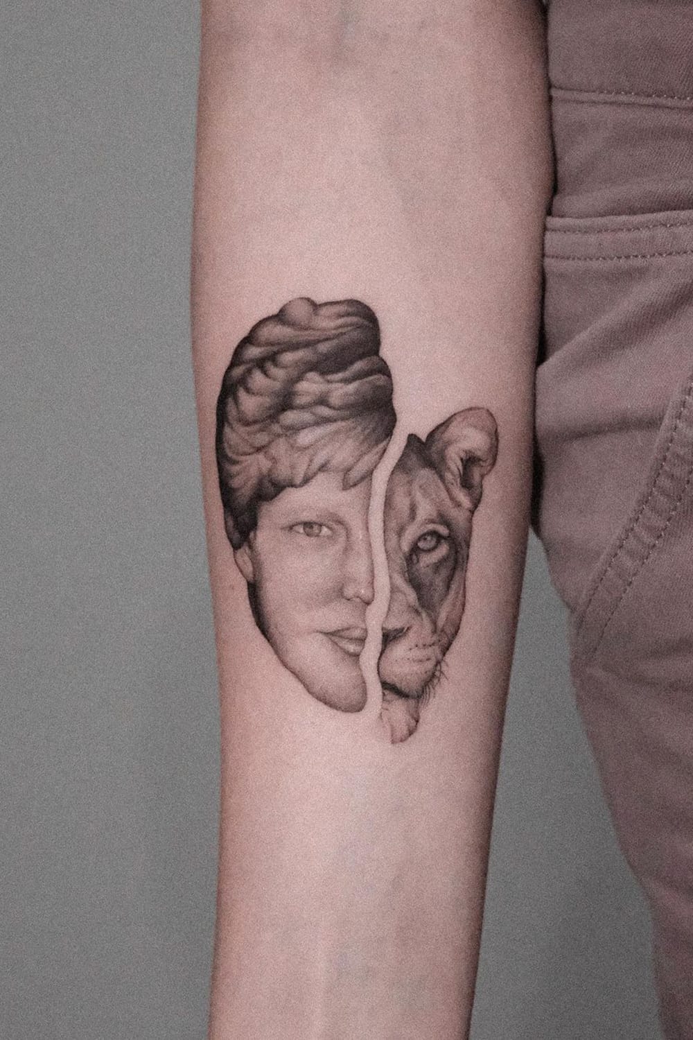 Portrait and lion tattoo