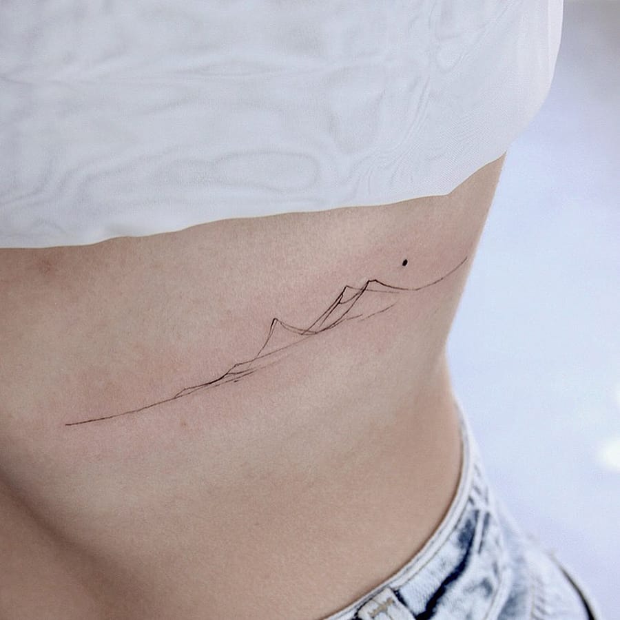 Ultra minimalist mountain tattoo