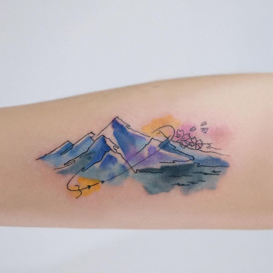 Watercolor mountain tattoo