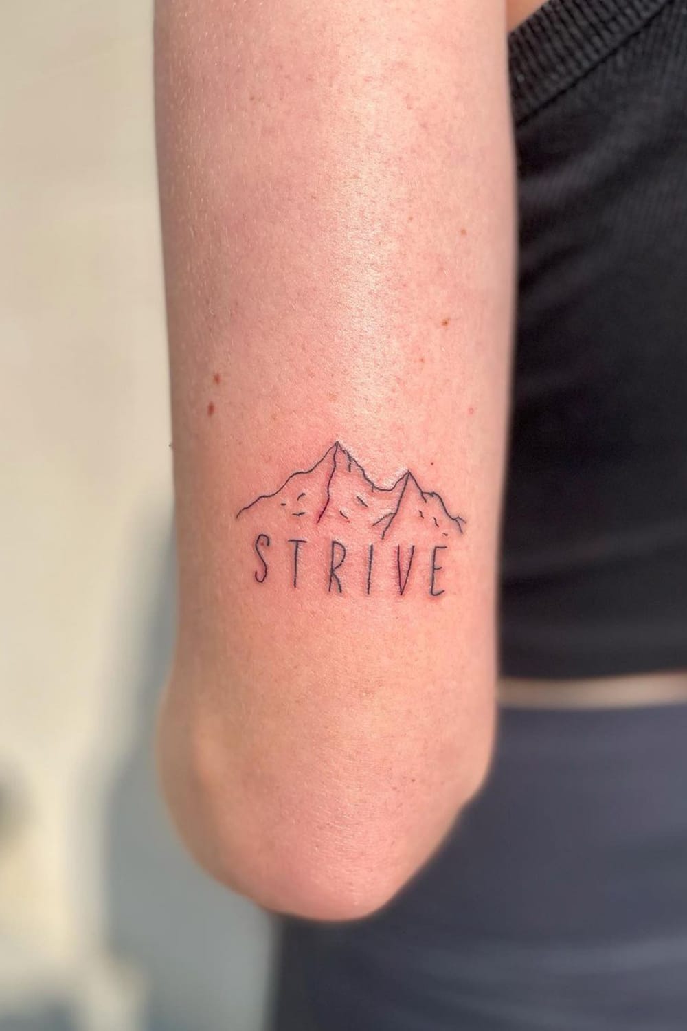 Word and Mountain Tattoo