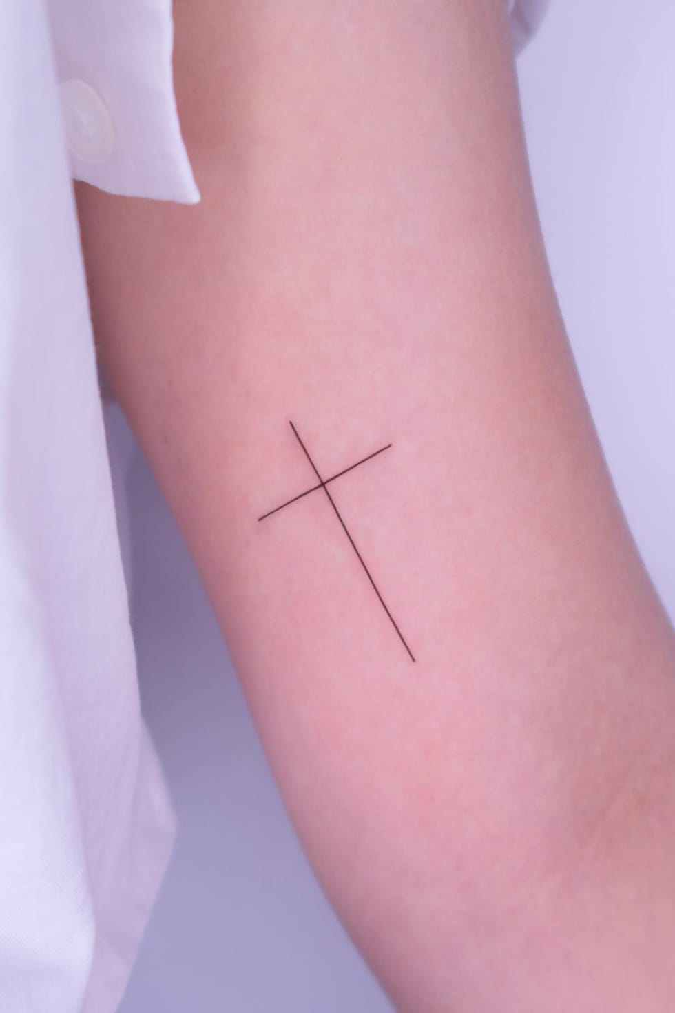 Minimalist Small Cross Tattoo