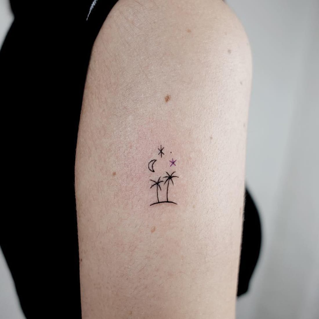 Small palm tree tattoo