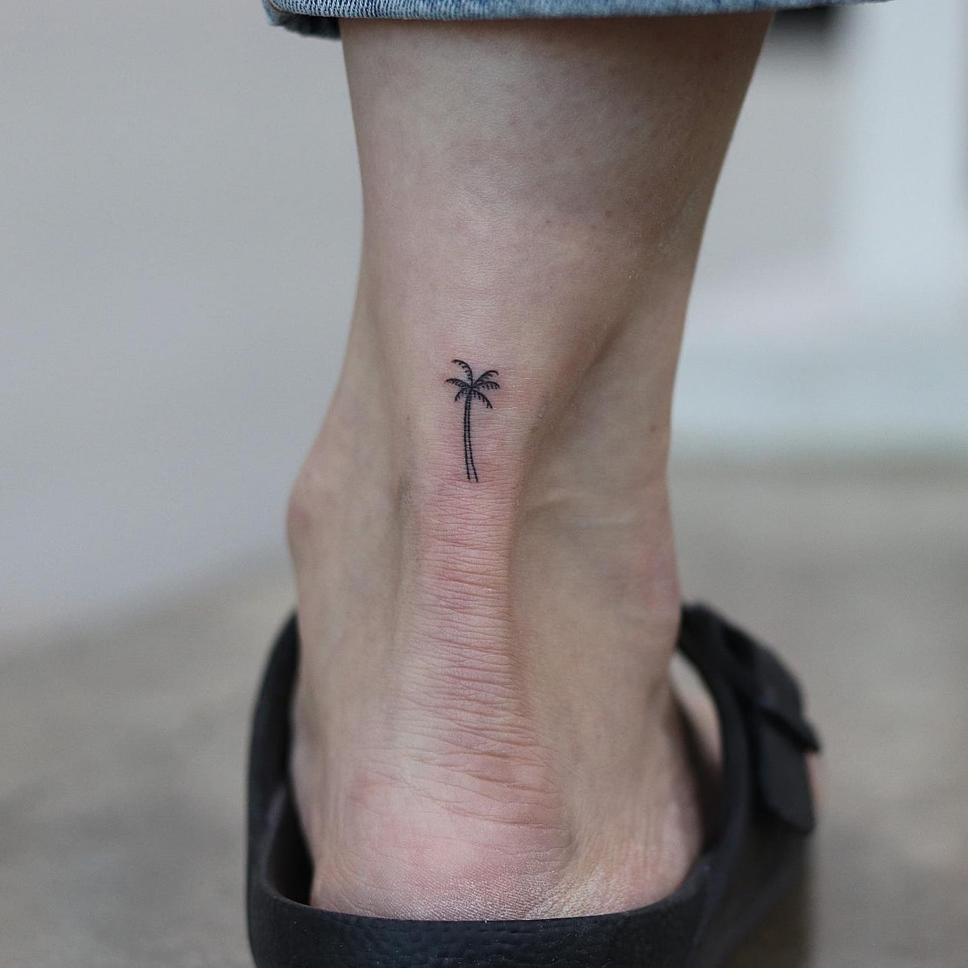 Small palm tree tattoo