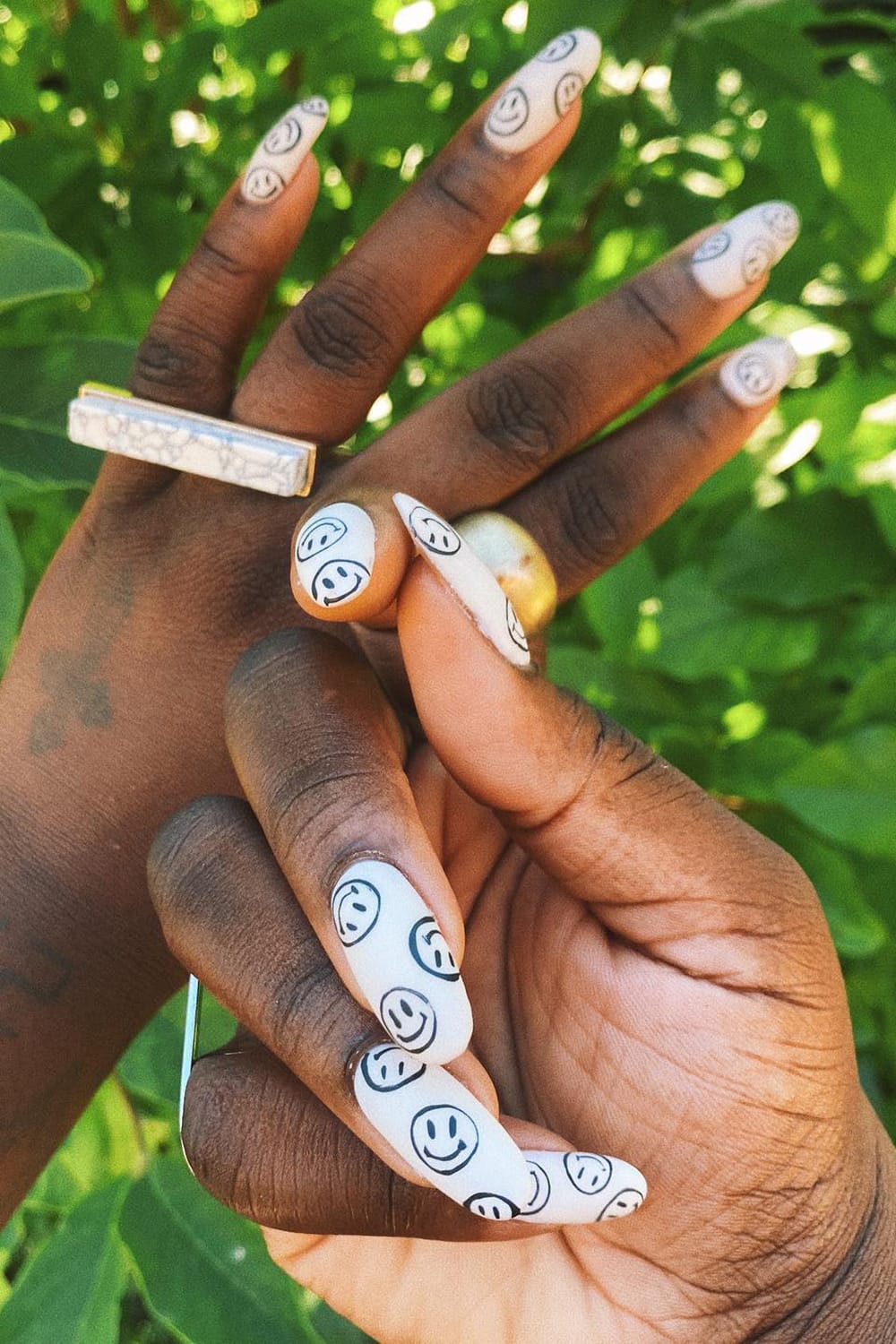 Black And White Smiley Face Almond Nails