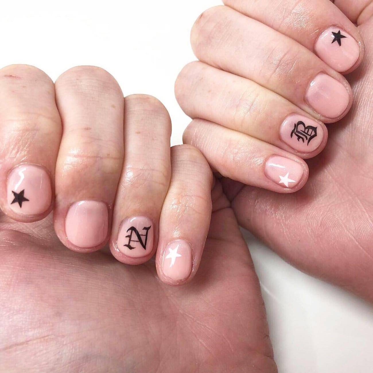 Letters and stars on short nails