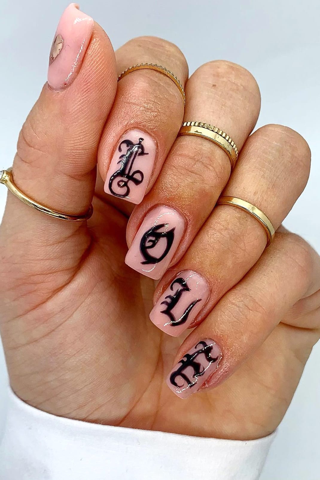 Nude nails with old English letters