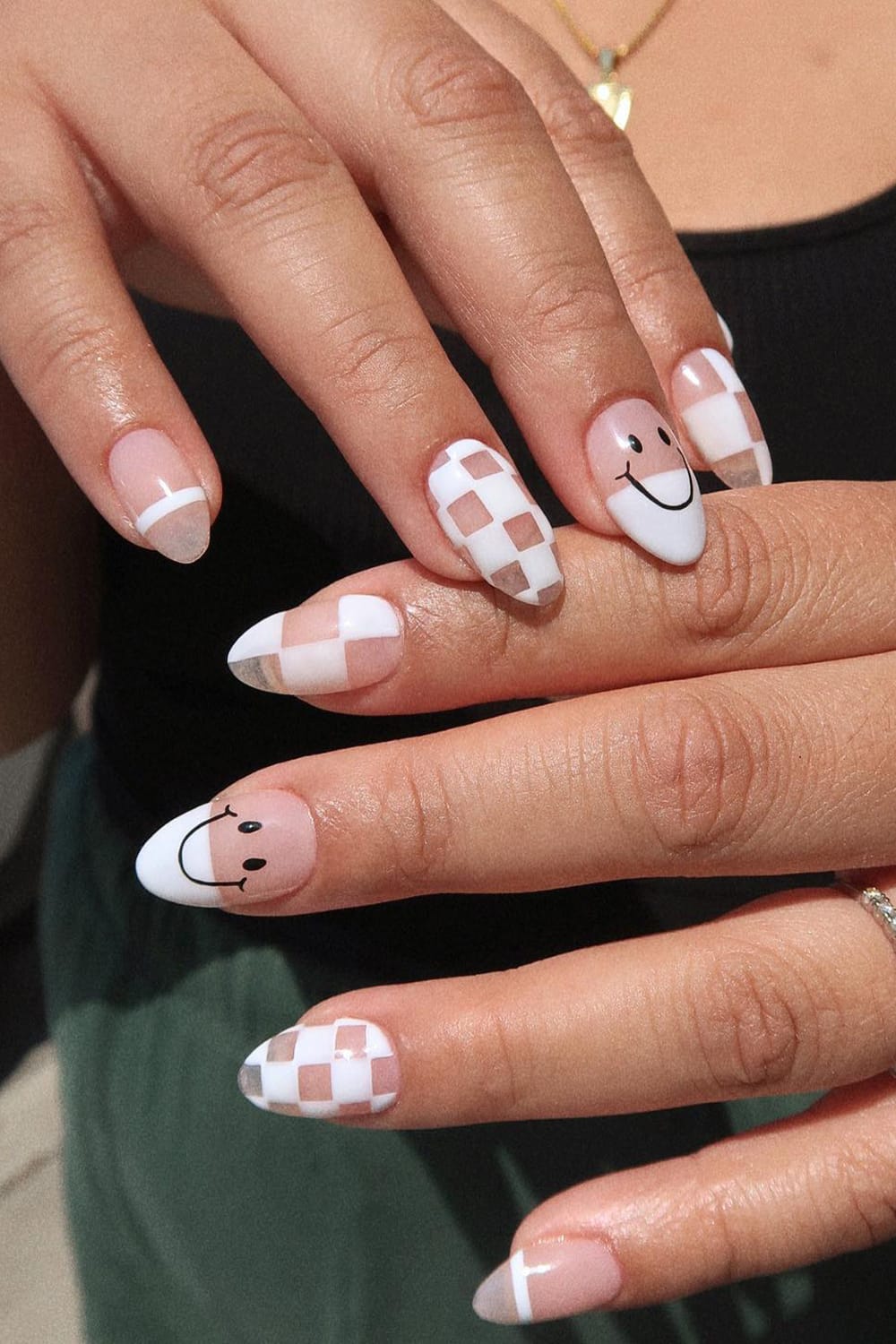 White Nails With Black Smiley Face On Middle Finger
