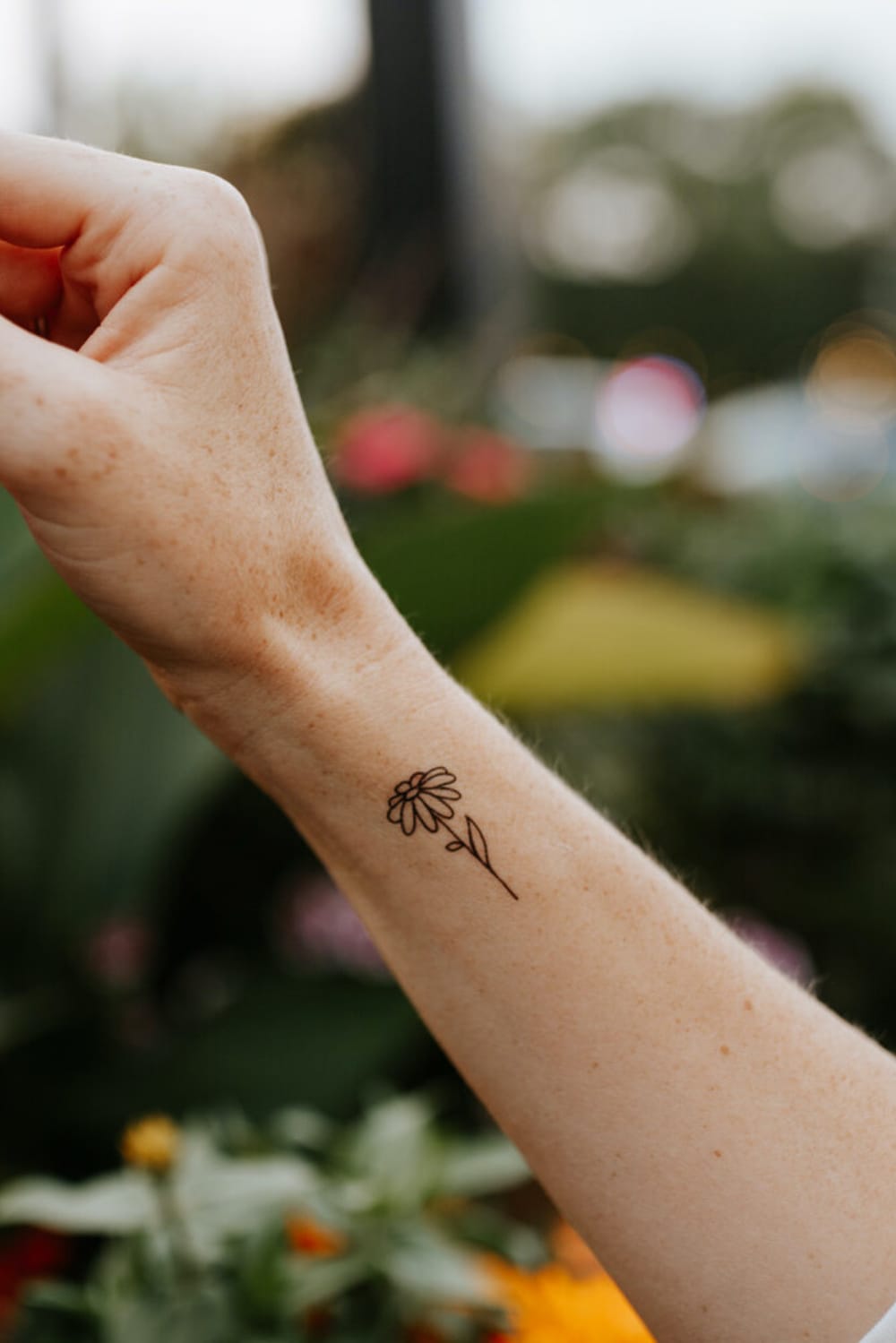 Small Daisy tattoo