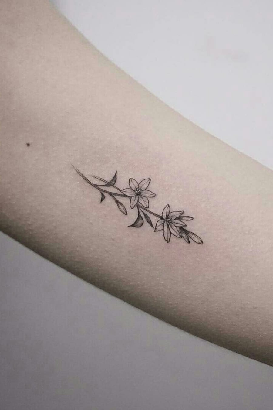 Small lily tattoo