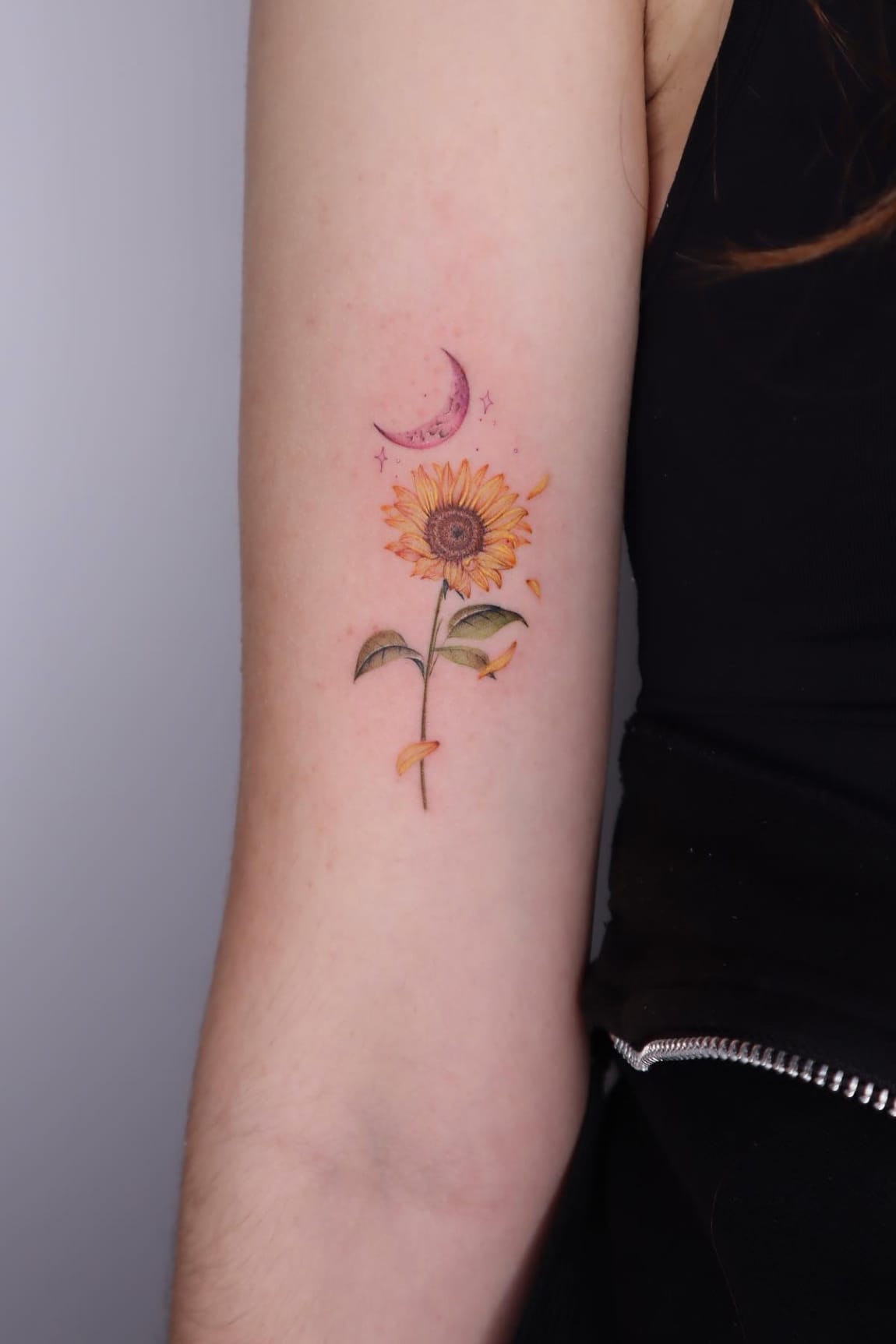 Small sunflower and moon tattoo
