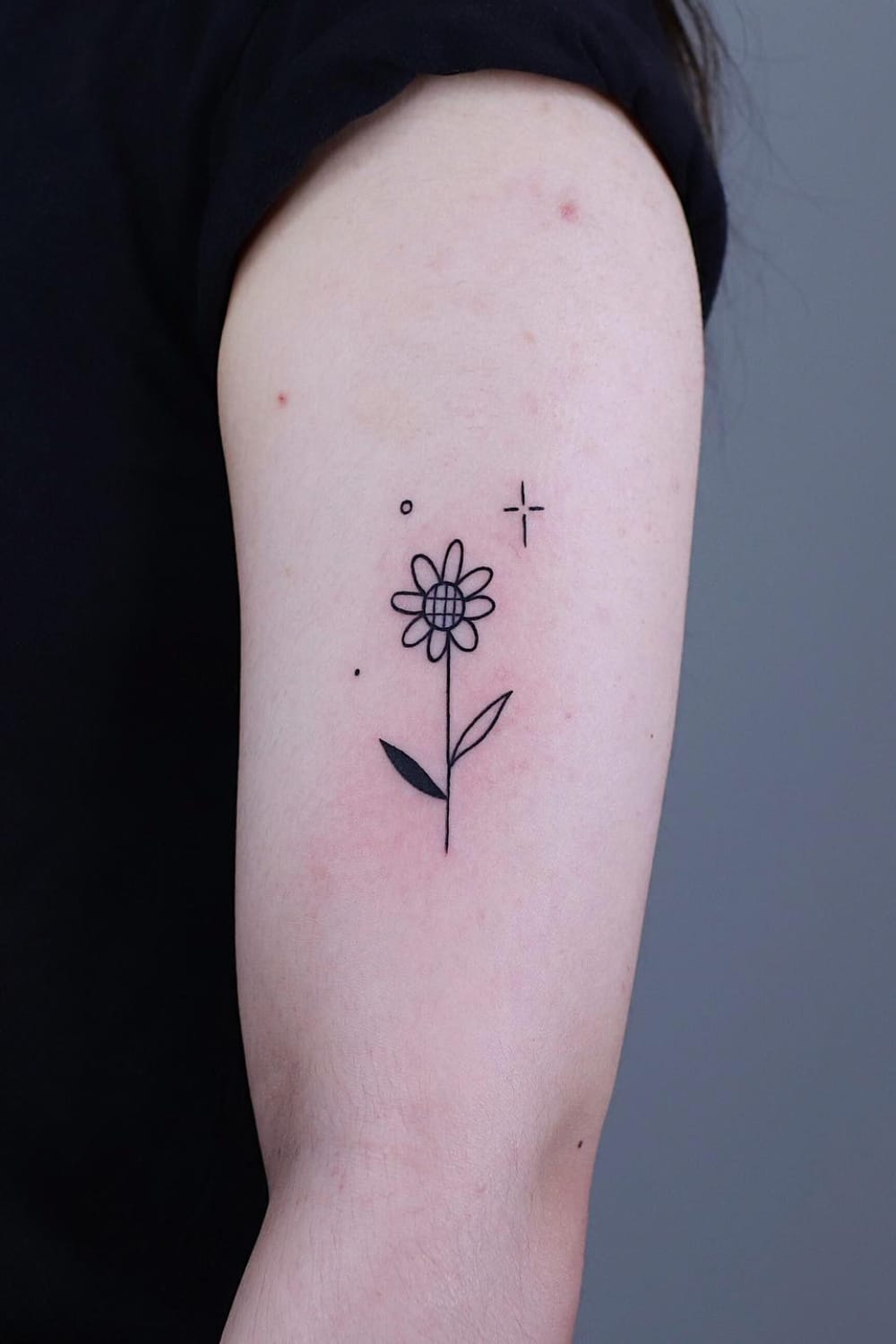 Small sunflower line tattoo