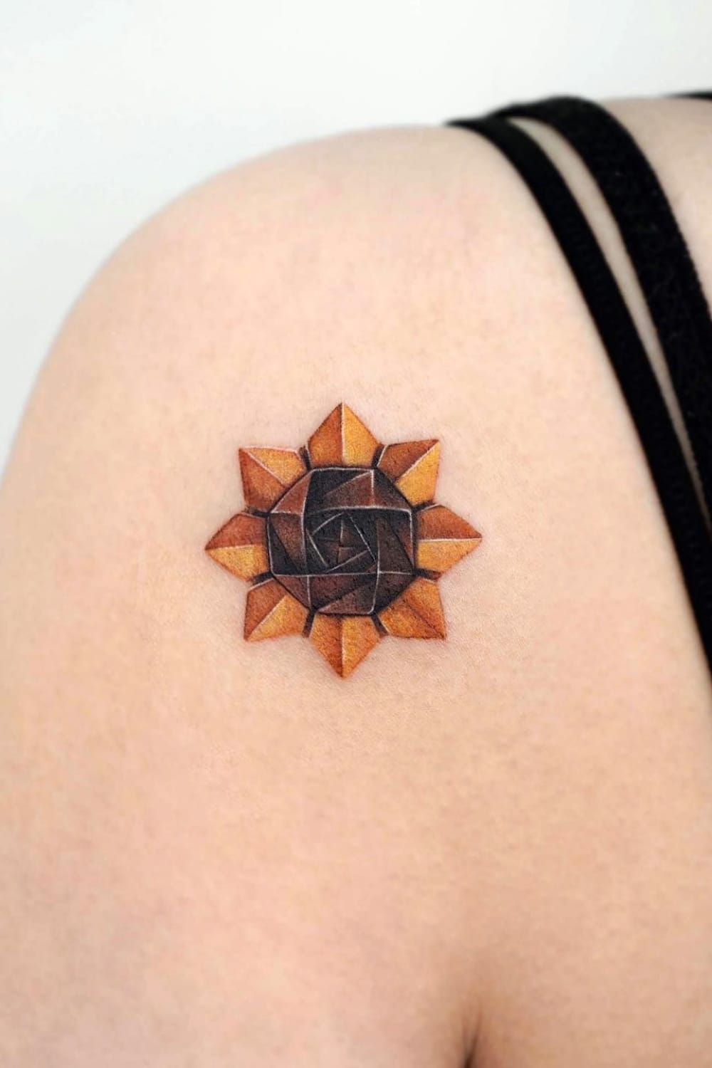 Small sunflower origami tattoo