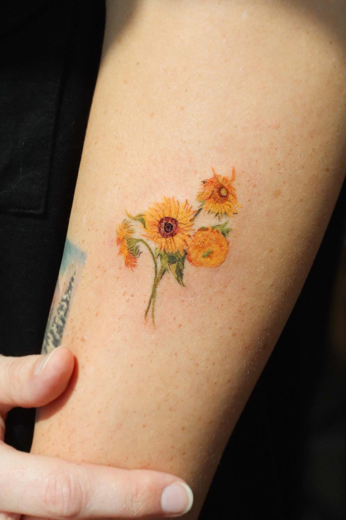 dainty small sunflower tattoo