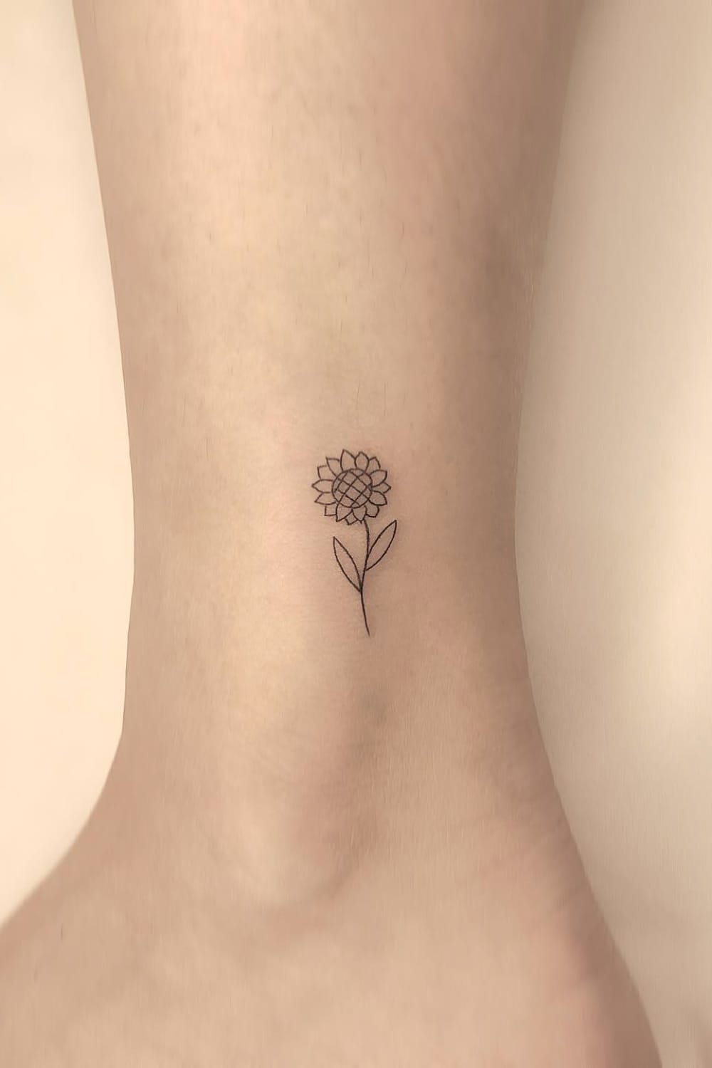 minimalist small sunflower tattoo