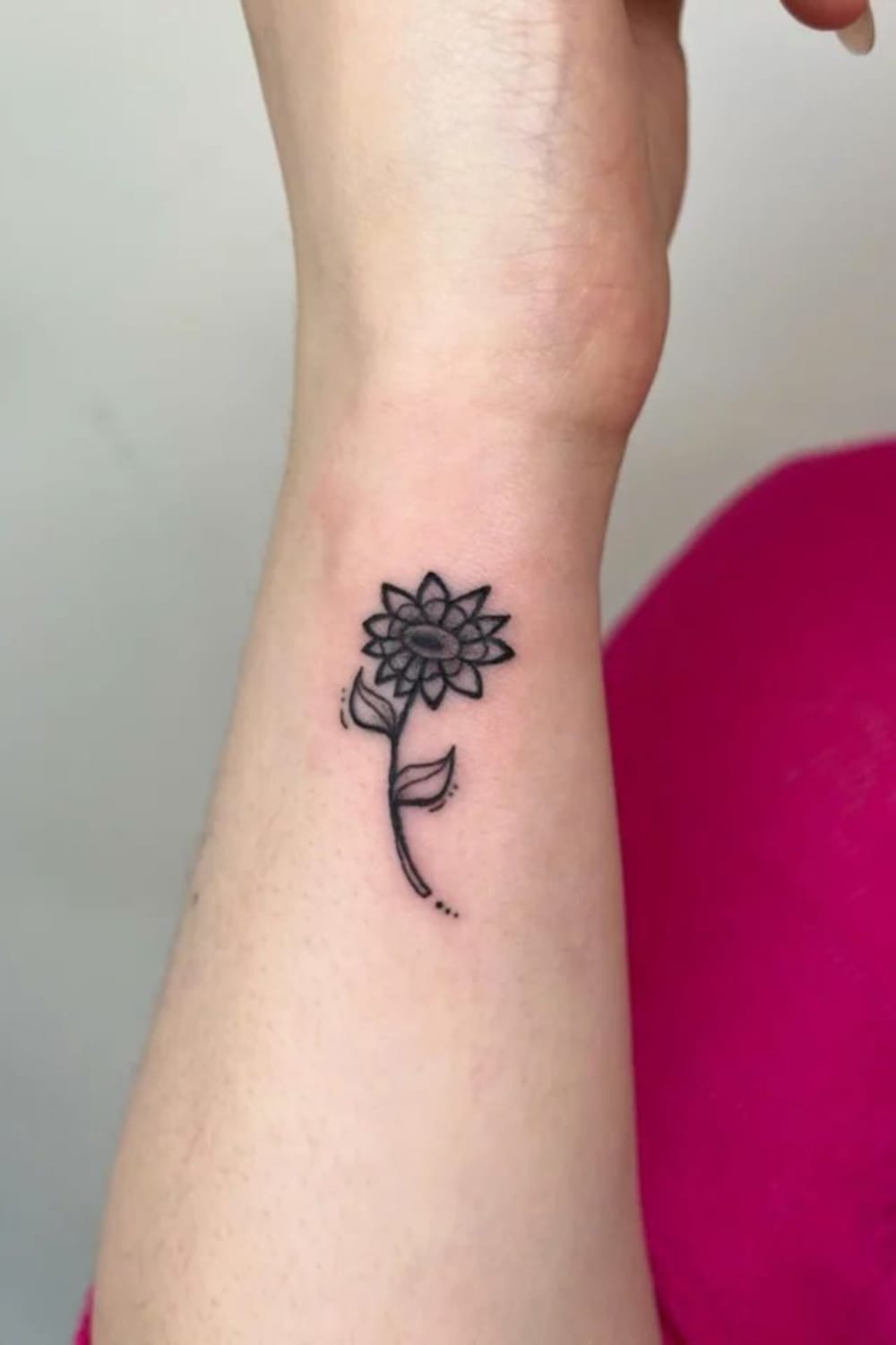 small black sunflower tattoo