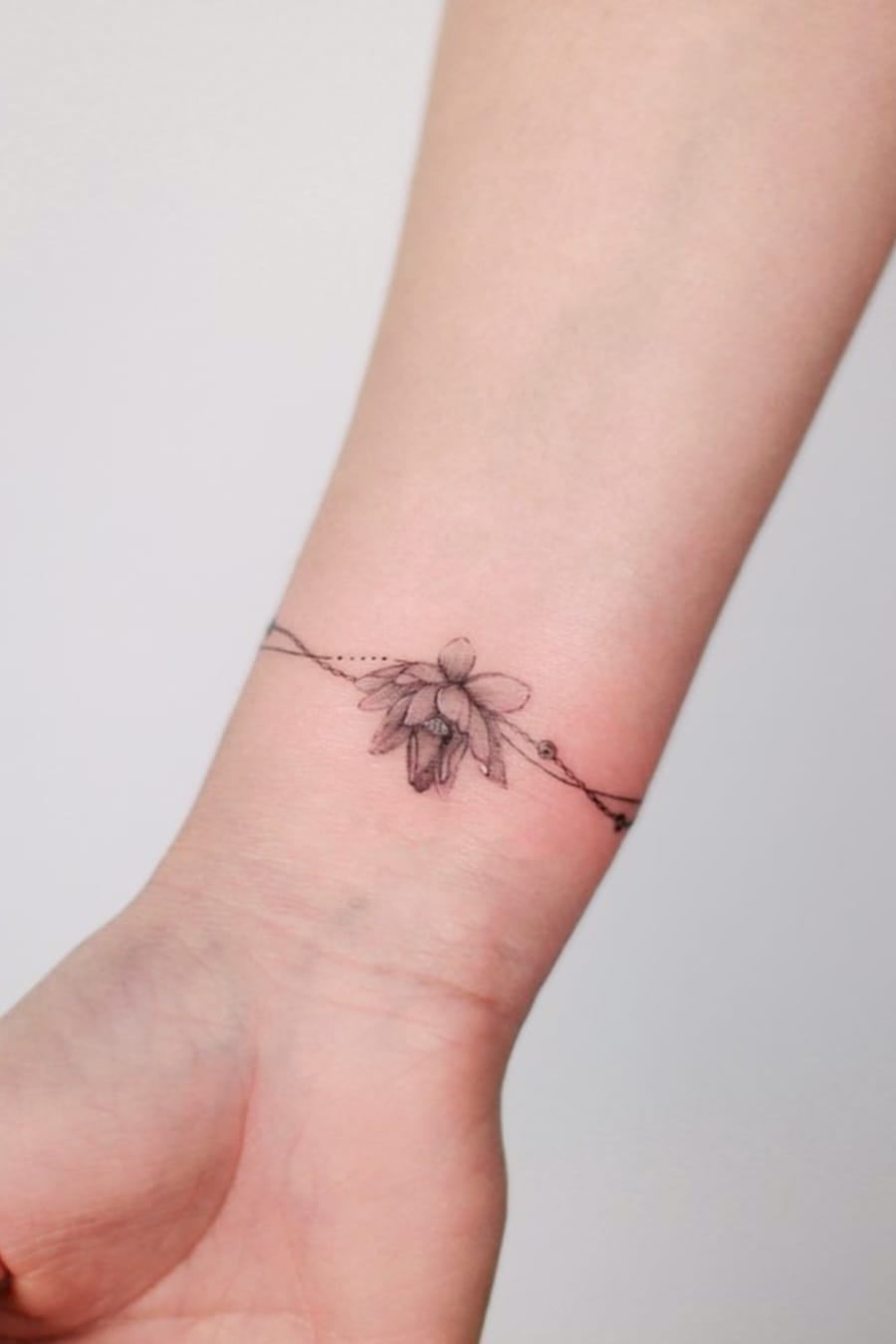 Small Flower Bracelet Tattoo