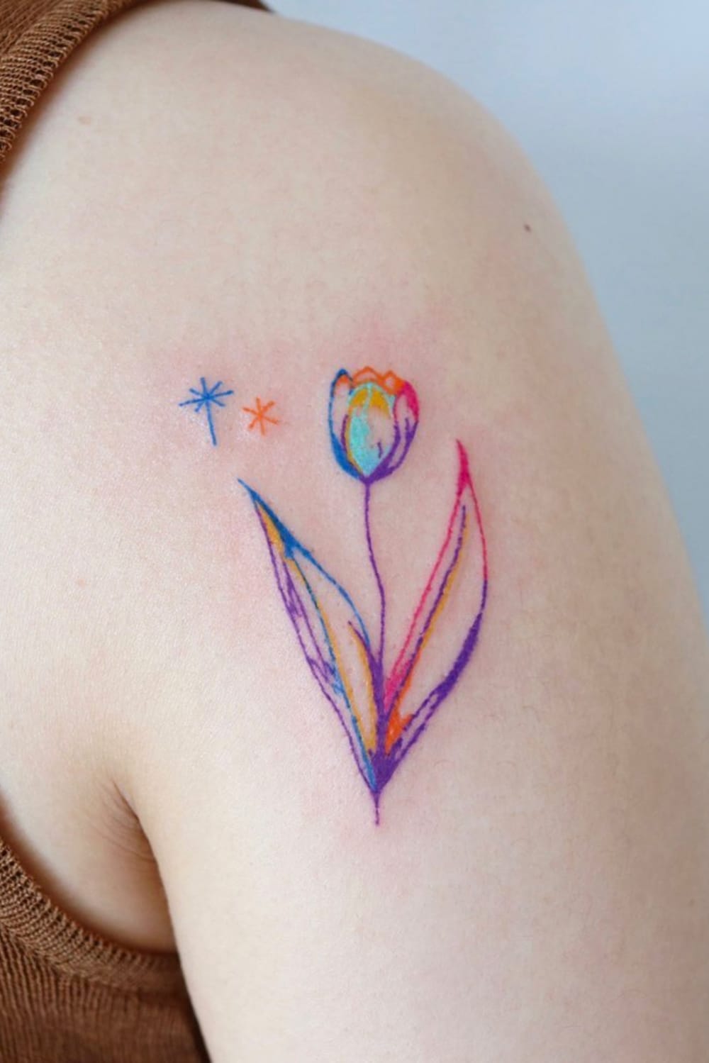 Watercolor small flower tattoo