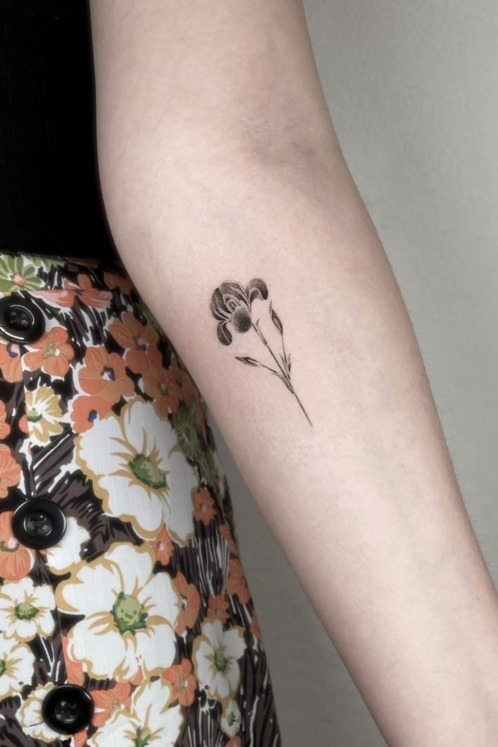 black and white small flower tattoo