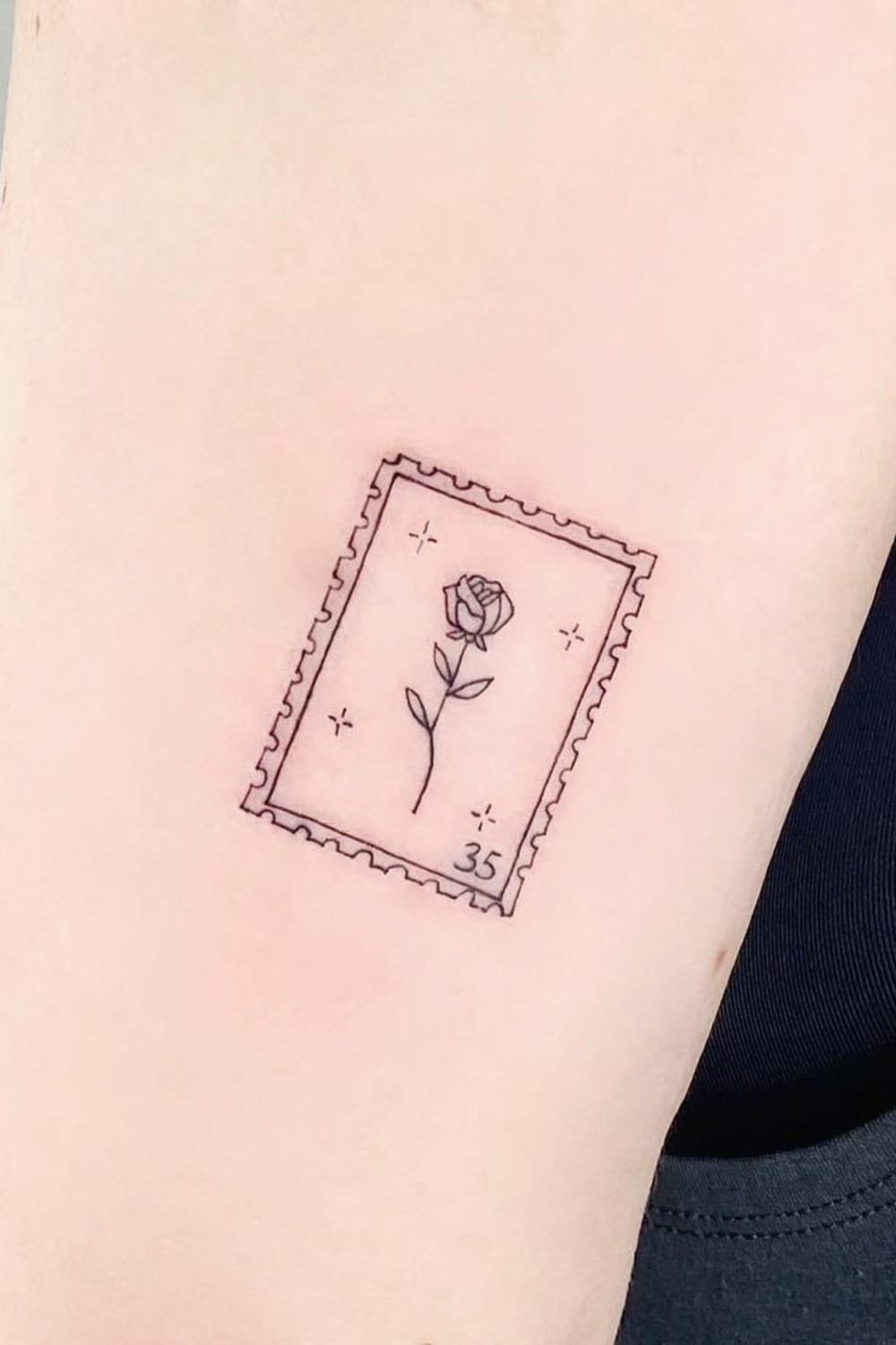 Small Flower Stamp Tattoo