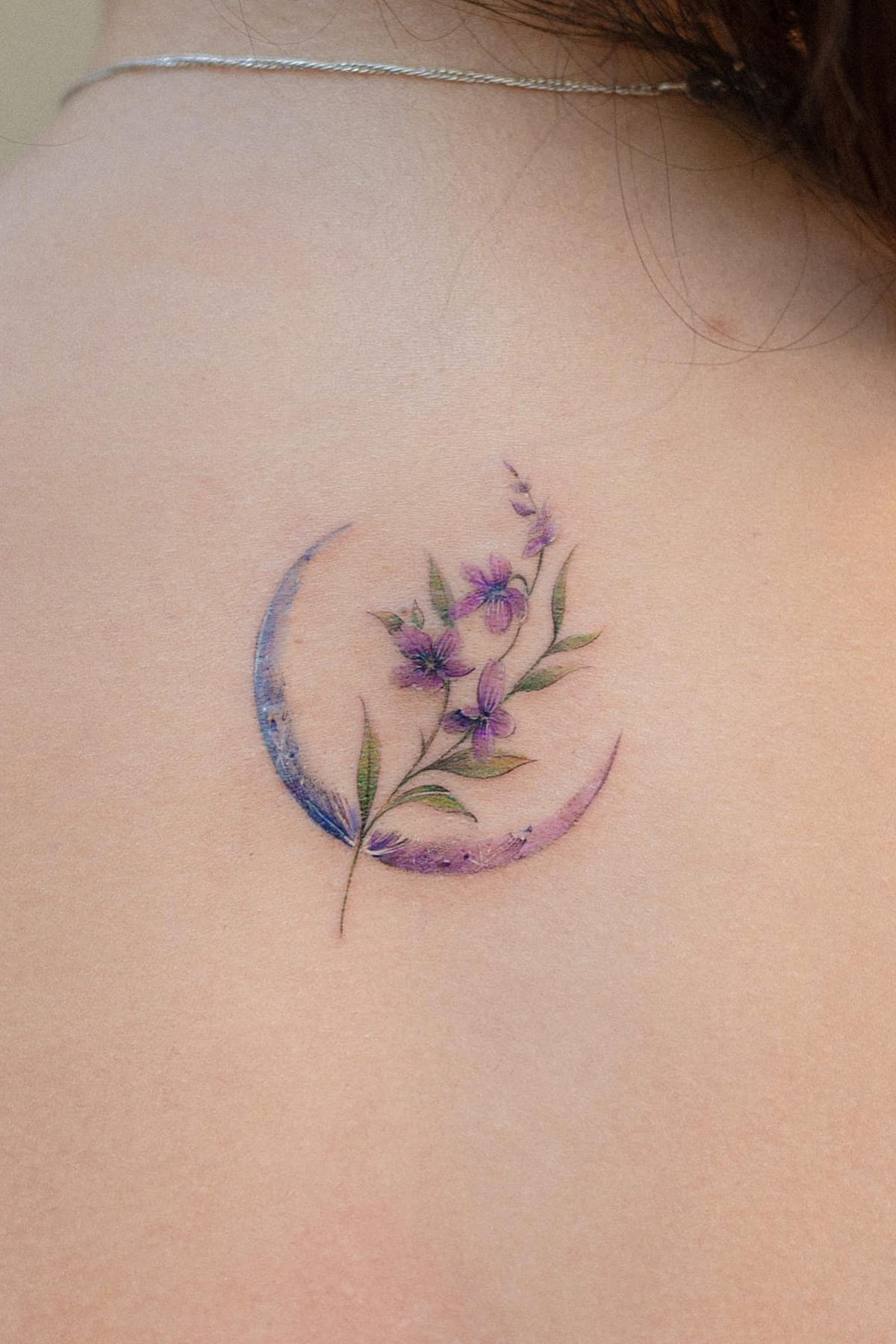 Small flower tattoo with moon