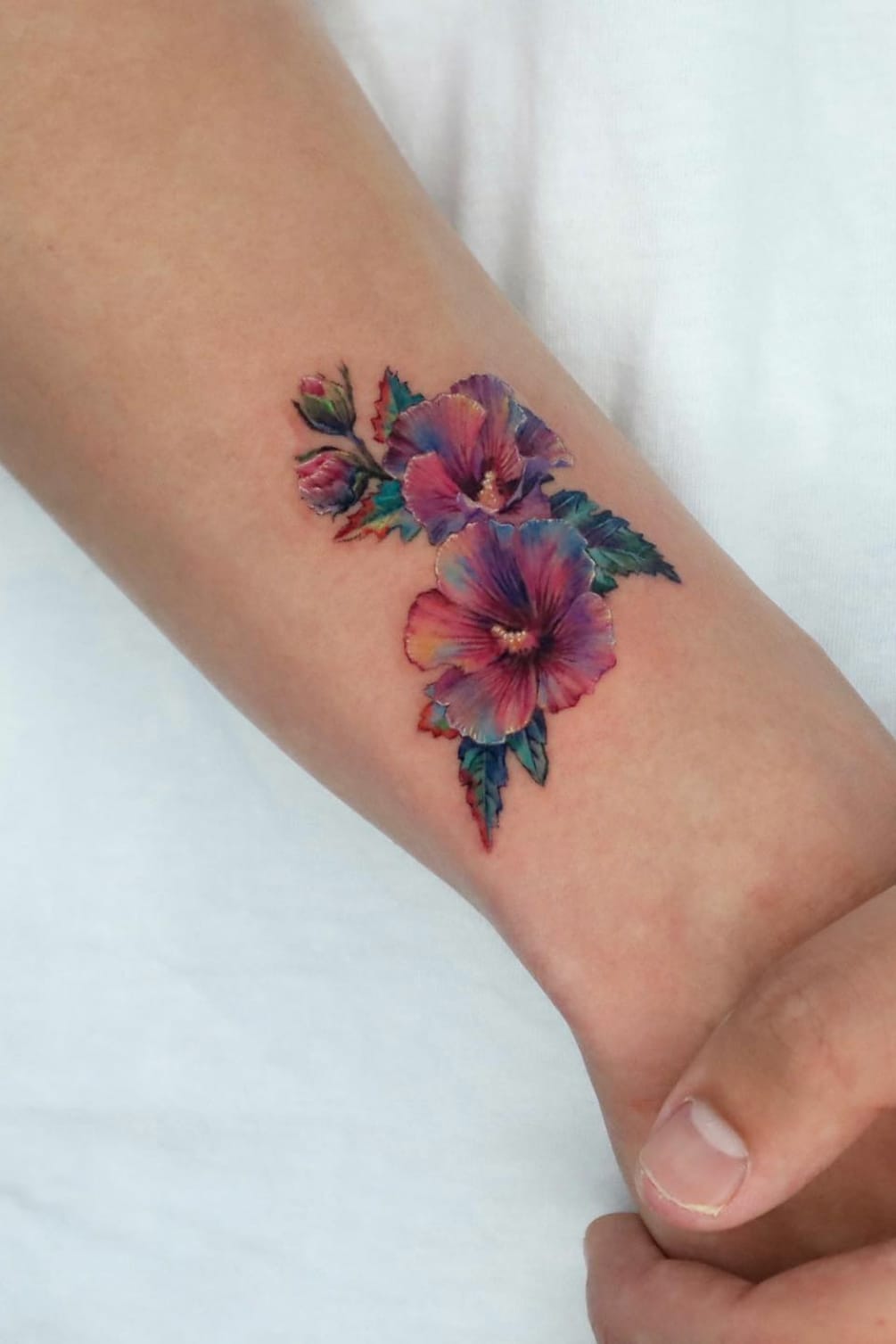 colorful small flower tattoo