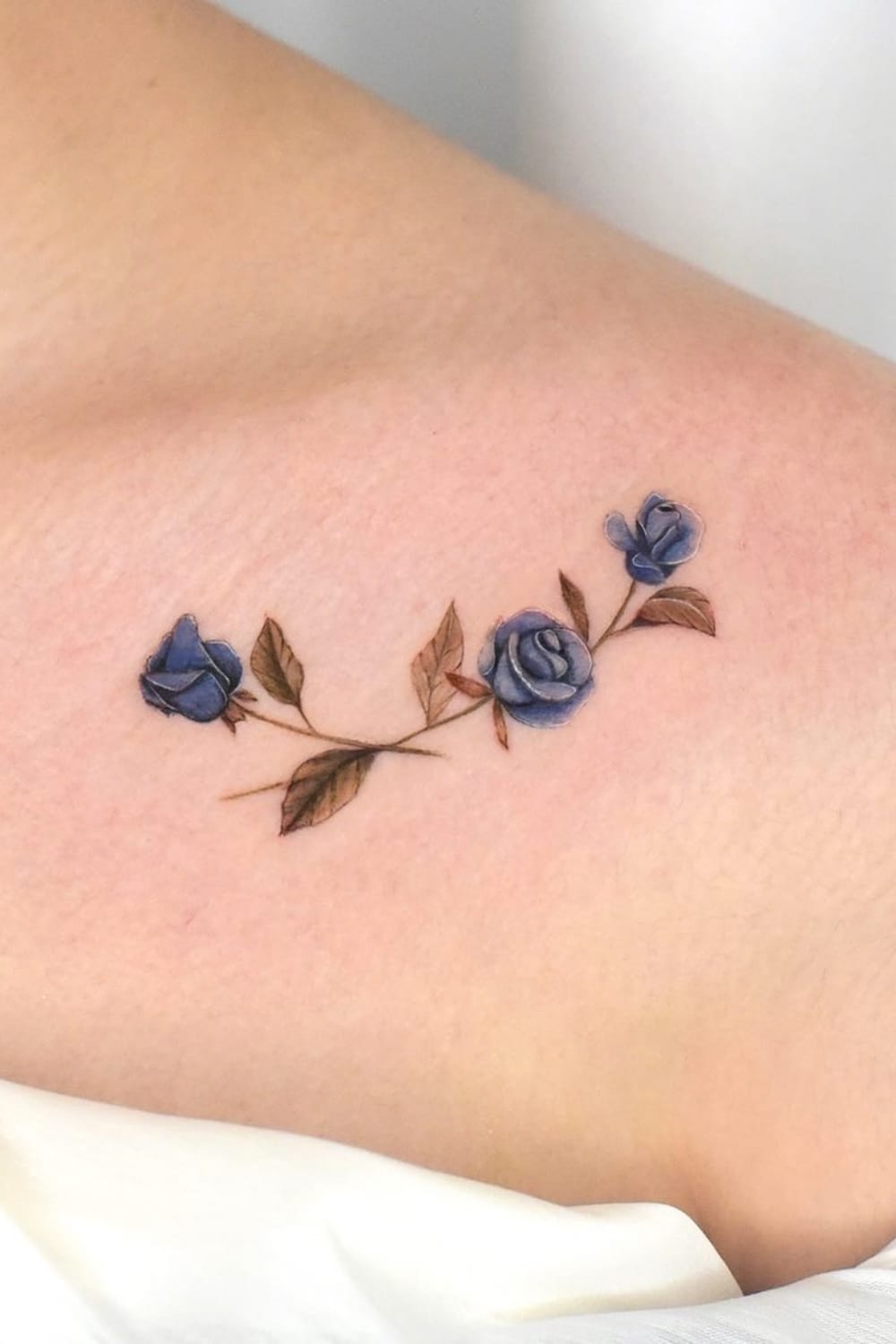 small blue rose tattoo