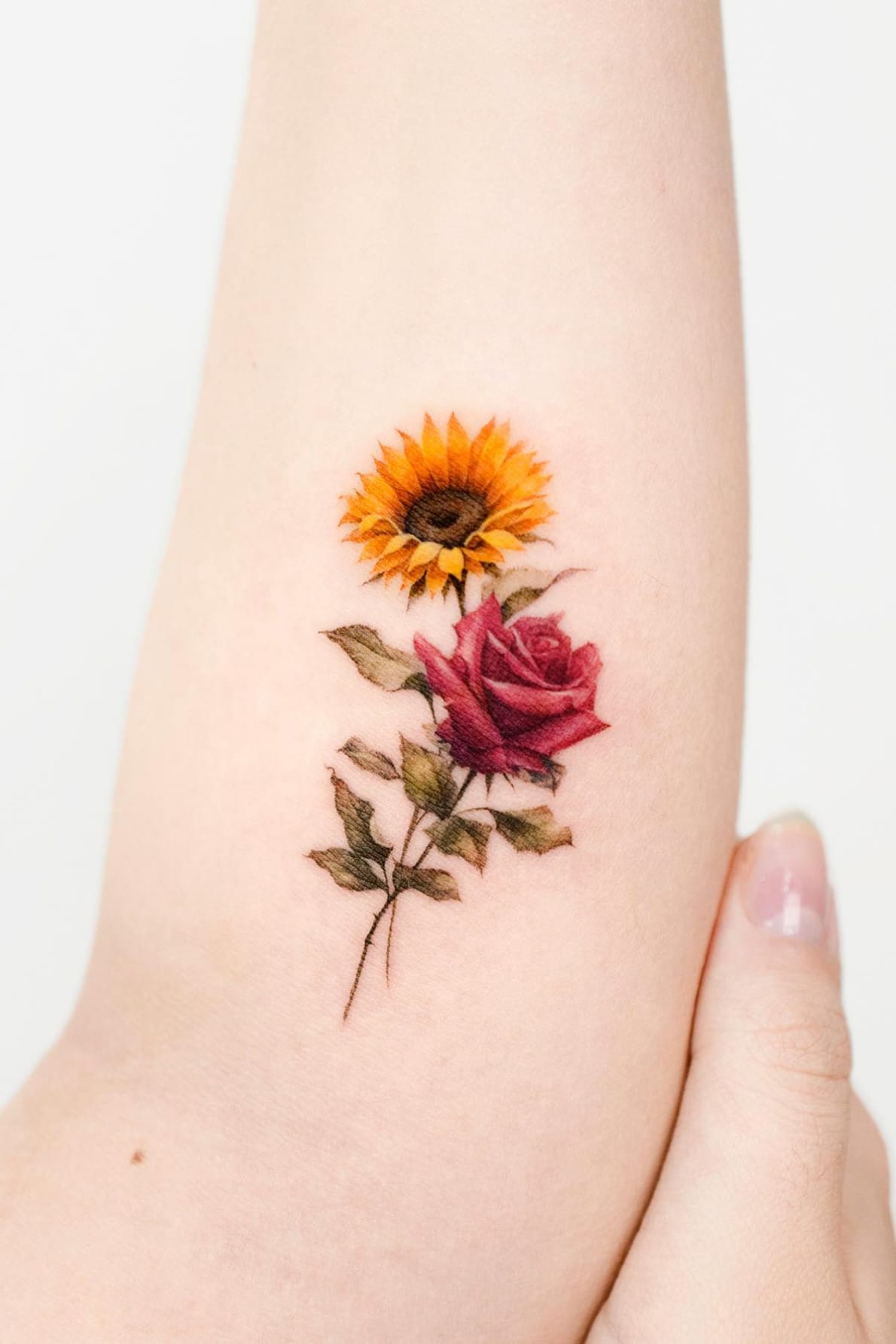 small rose and sunflower tattoo
