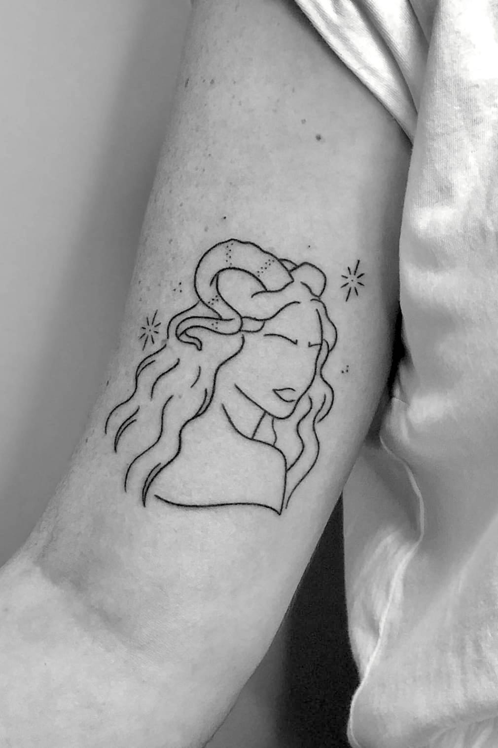 Minimalist Aries Woman Portrait Tattoo