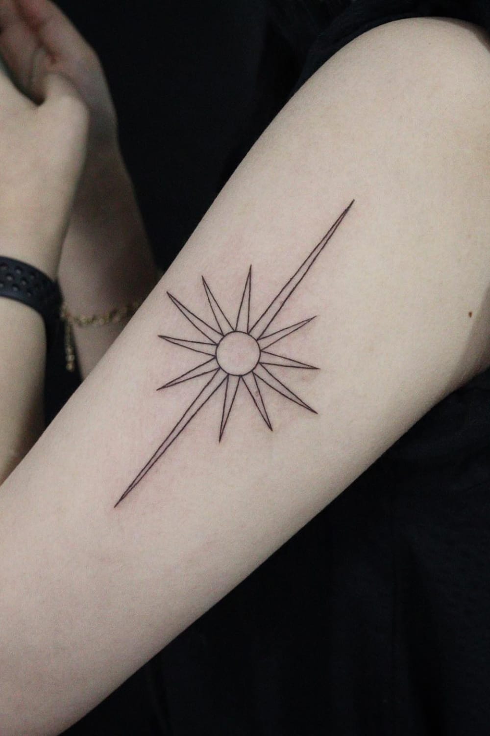 Simple sun tattoo